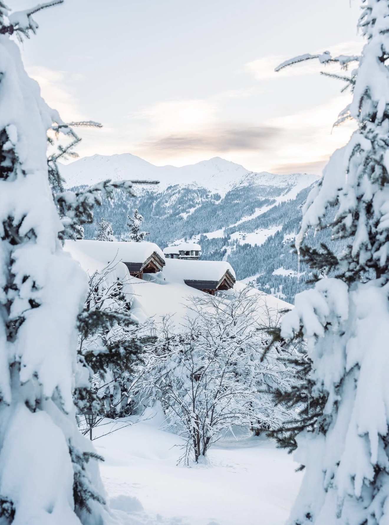 Deep snow surrounding secluded chalets in the Swiss Alps