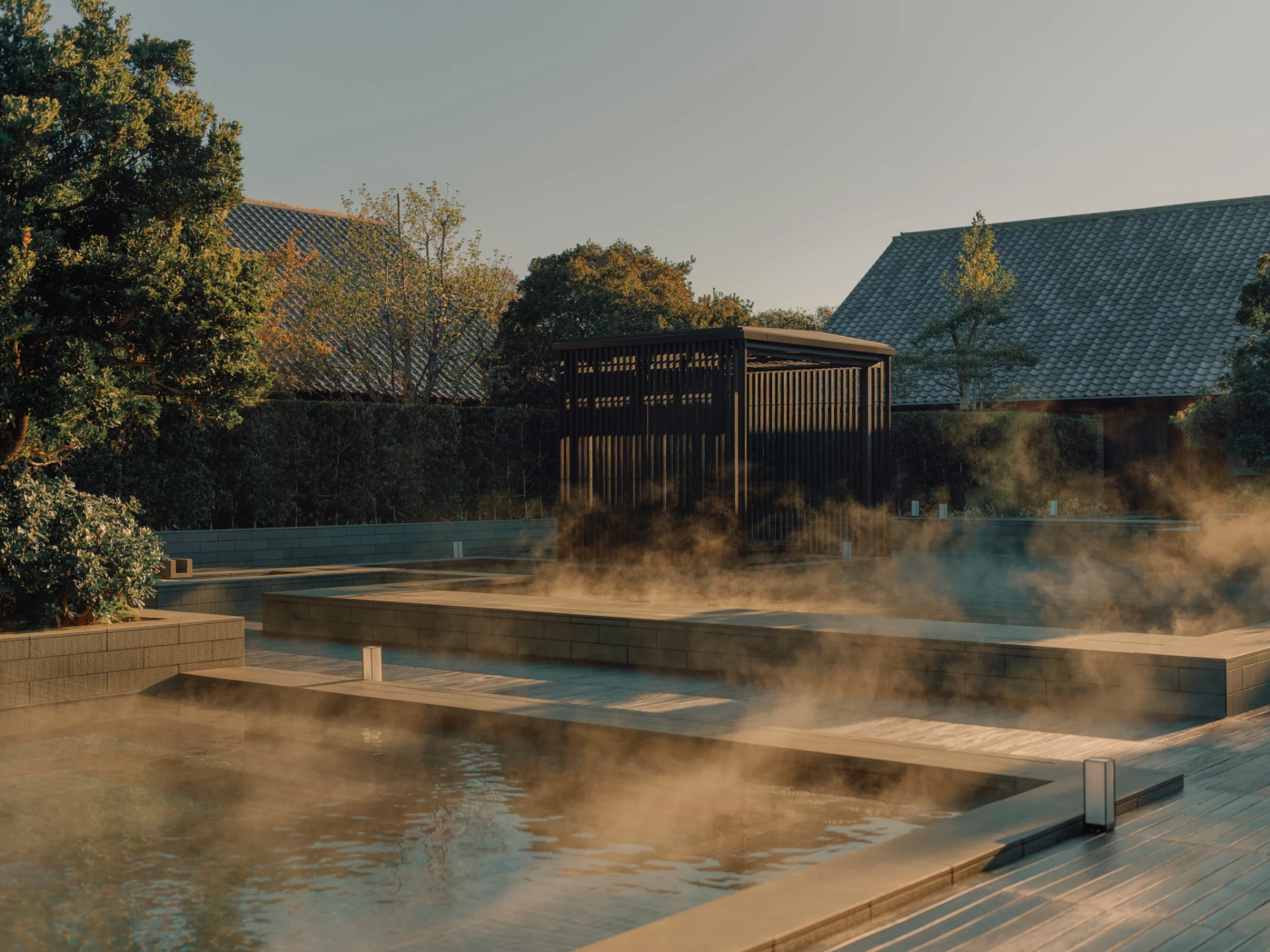 Steaming outdoor mineral pools in a quiet Japanese garden