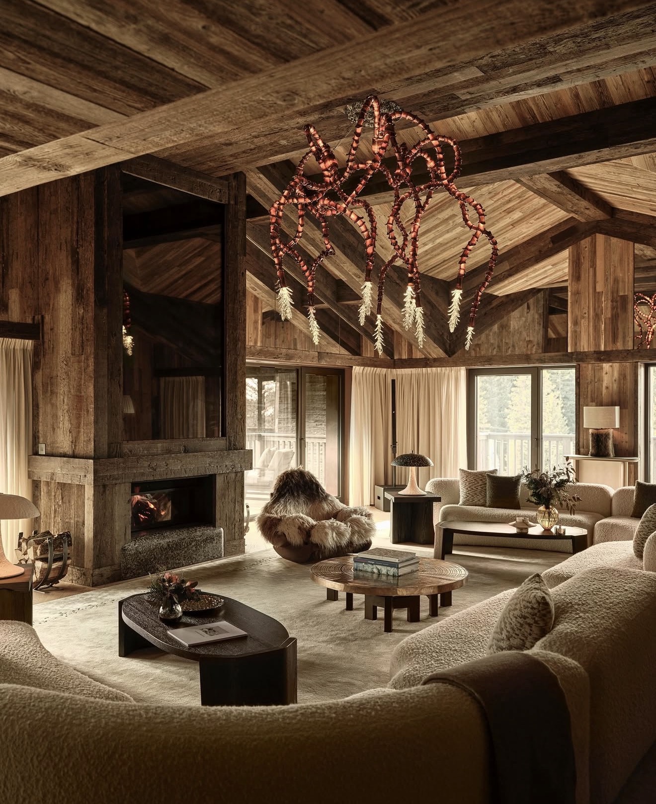 Warm timber chalet salon with a fireplace