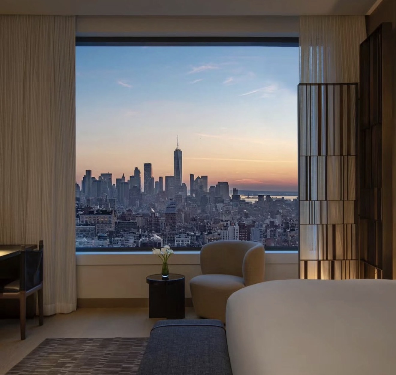 Manhattan skyline at sunset from a serene New York suite